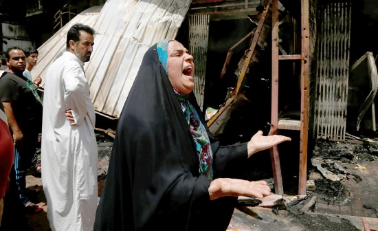 ﻿عراقية تصرخ متأثرة بعد انفجار سيارة مفخخة في مدينة الصدر أمس - reuters