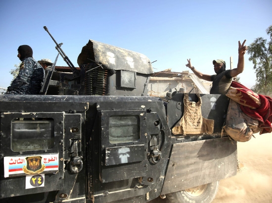 ﻿ قوات الحكومة العراقية في حي الشهداء جنوب الفلوجة - afp