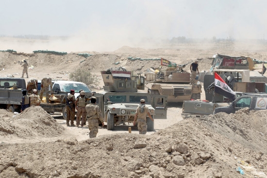 ﻿القوات العراقية في منطقة الخالدية أثناء قتال «داعش» - afp