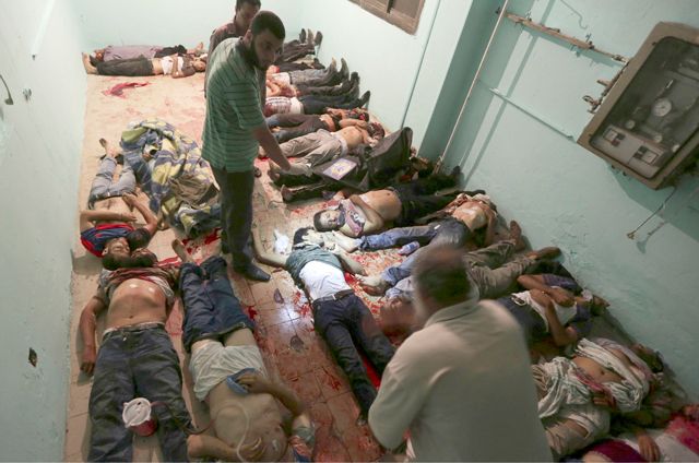  جثث ضحايا حادث إطلاق النار الذي وقع بالقرب من ثكنات الحرس الجمهوري المصري - REUTERS