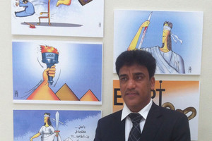 فنان الكاريكاتير علي خليل يشارك في الملتقى الدولي الثالث للكاريكاتير بمصر