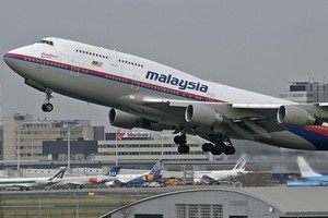 سوء الأحوال الجوية يؤجل أعمال البحث عن طائرة الخطوط الماليزية المنكوبة