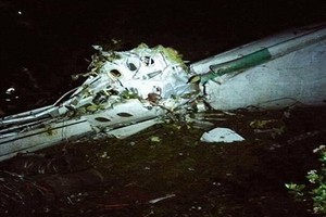 العثور على الصندوقين الأسودين في 'حالة ممتازة' في موقع تحطم الطائرة الكولومبية