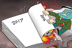 كاريكاتير 'الاتحاد الإماراتية': العالم يطوي صفحة 2016 المليئة بالانفجارات