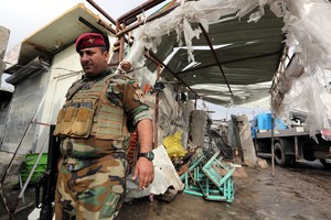 بالصور... 32 قتيلاً في تفجير انتحاري في بغداد تزامناً مع زيارة هولاند