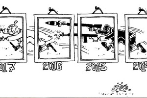 كاريكاتير 'الوطن العمانية': عامٌ جديد...ولا يزال 'الإرهاب' يلاحق العالم