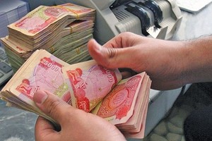 العراق: دعوات إلى رفع قيمة الدينار