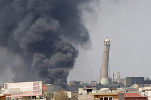 القوات العراقية تقترب من جامع النوري بالموصل ومقتل 17 ببغداد